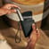 Hand holding a Ploom Duo Carry Case Jet Black accessory