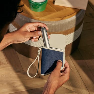 Hand holding a Ploom Duo Carry Case Denim Leather Fusion accessory