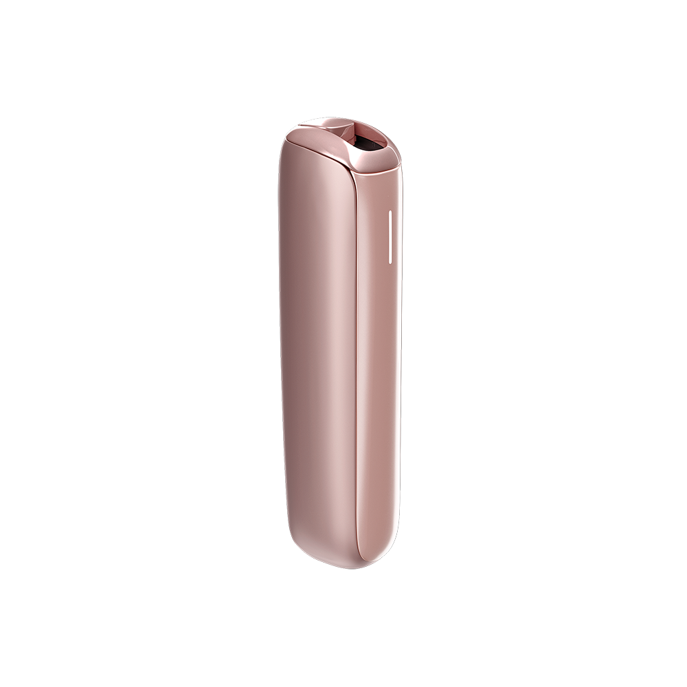 Ploom AURA Rose Gold device on a table during a coffee break.