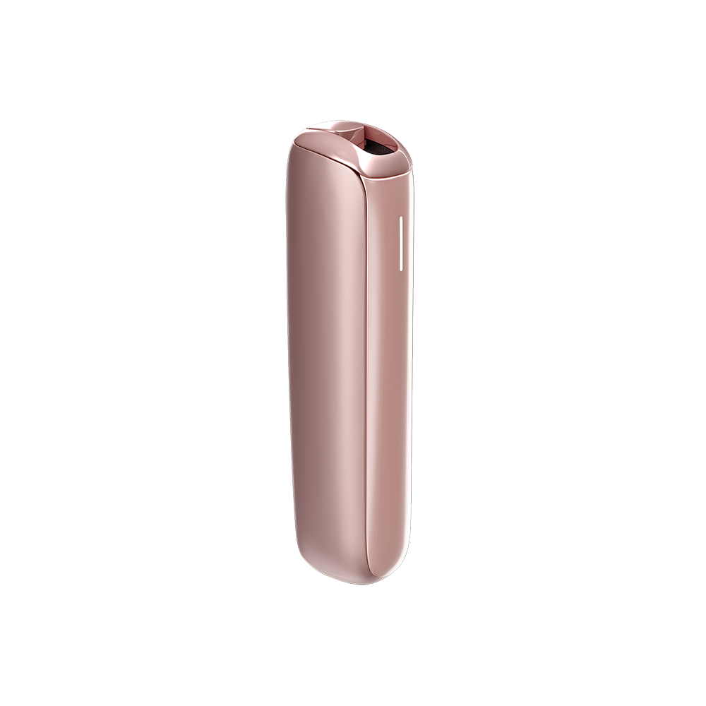 Ploom AURA Rose Gold device on a table during a coffee break.